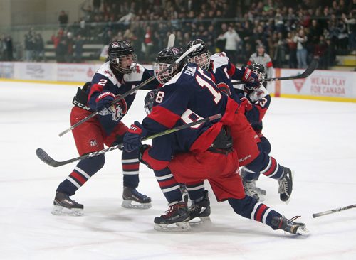 JASON HALSTEAD / WINNIPEG FREE PRESS
Shaftesbury High School Titans celebrate after Sutter Charron scored in the dying seconds to take the lead against the J.H. Bruns Collegiate Broncos during game 3 of the Winnipeg Free Press Division Winnipeg High School Hockey League final series on March 7, 2019 at the Bell MTS Iceplex. (See Sawatzky story)