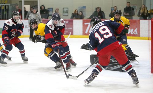JASON HALSTEAD / WINNIPEG FREE PRESS
Sutter Charron of the Shaftesbury High School Titans prepares to score the game-winner against the J.H. Bruns Collegiate Broncos during game 3 of the Winnipeg Free Press Division Winnipeg High School Hockey League final series on March 7, 2019 at the Bell MTS Iceplex. (See Sawatzky story)