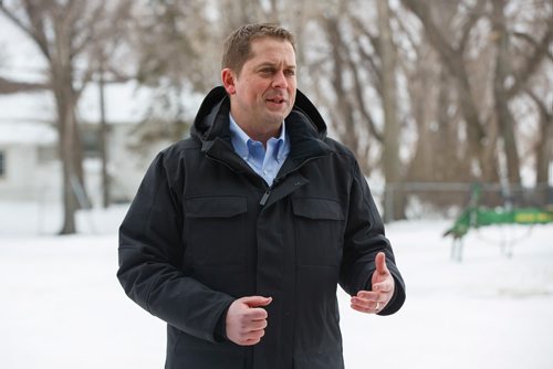 MIKE DEAL / WINNIPEG FREE PRESS
Federal Conservative Party Leader, Andrew Scheer with Gordon Grenkow on his family farm near Winnipeg, MB, speaks to the media regarding his plan to remove the GST from home heating and energy bills if his party is elected.
190308 - Friday, March 08, 2019.