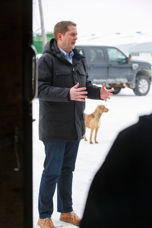 MIKE DEAL / WINNIPEG FREE PRESS
Federal Conservative Party Leader, Andrew Scheer with Gordon Grenkow on his family farm near Winnipeg, MB, speaks to the media regarding his plan to remove the GST from home heating and energy bills if his party is elected.
190308 - Friday, March 08, 2019.