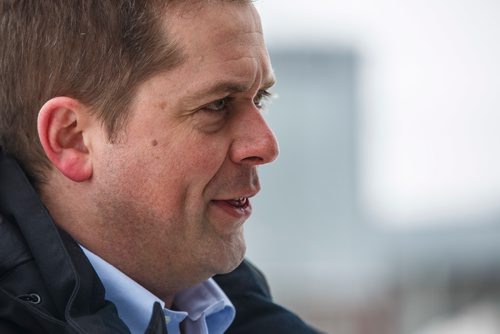 MIKE DEAL / WINNIPEG FREE PRESS
Federal Conservative Party Leader, Andrew Scheer with Gordon Grenkow on his family farm near Winnipeg, MB, speaks to the media regarding his plan to remove the GST from home heating and energy bills if his party is elected.
190308 - Friday, March 08, 2019.