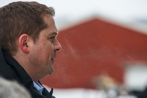 MIKE DEAL / WINNIPEG FREE PRESS
Federal Conservative Party Leader, Andrew Scheer with Gordon Grenkow on his family farm near Winnipeg, MB, speaks to the media regarding his plan to remove the GST from home heating and energy bills if his party is elected.
190308 - Friday, March 08, 2019.