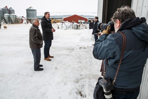 MIKE DEAL / WINNIPEG FREE PRESS
Federal Conservative Party Leader, Andrew Scheer with Gordon Grenkow on his family farm near Winnipeg, MB, speaks to the media regarding his plan to remove the GST from home heating and energy bills if his party is elected.
190308 - Friday, March 08, 2019.