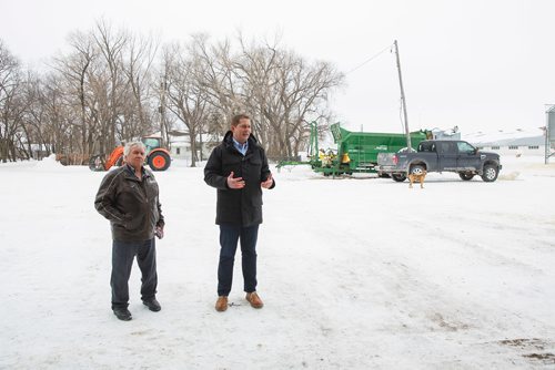 MIKE DEAL / WINNIPEG FREE PRESS
Federal Conservative Party Leader, Andrew Scheer with Gordon Grenkow on his family farm near Winnipeg, MB, speaks to the media regarding his plan to remove the GST from home heating and energy bills if his party is elected.
190308 - Friday, March 08, 2019.