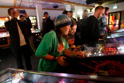 PHIL HOSSACK / WINNIPEG FREE PRESS - Dexter Lee 12, (left) and Nolan Swanson-Bilyk get into a pinball game at a Pinball Popup Friday night at the Forks See Declan's story re:Pinball Popup. January 8, 2019.