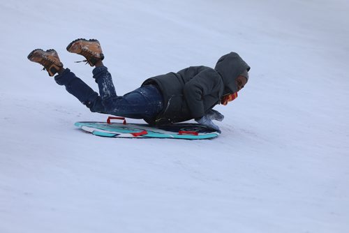 RUTH BONNEVILLE / WINNIPEG FREE PRESS
Local Standup
Isaac Dini (12yrs), slides down the toboggan hill at Westview Park in the warm weekend weather on Saturday.
March 09, 2019