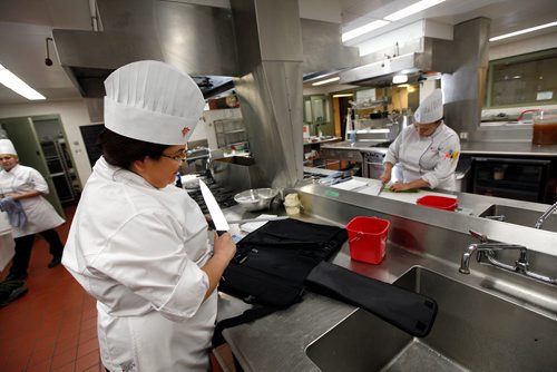 PHIL HOSSACK / WINNIPEG FREE PRESS - RRCC Culinary Skills Indigenous student Alexa Raven sharpens her knives while Larissa Evans chops green onions for omelettes for an Indigenous Pop Up restaurant. See Anders' story. -  March 11, 2019.