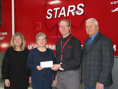 Canstar Community News March 5, 2019 - The RM of Rosser council agreed to donate $2, 744, which is $1 per capita for 2018 and 2019, to STARS Air Ambulance. The cheque presentation was made on March 5 with (from left) councillor Lee Garfinkel, reeve Frances Smee and (at right) councillor Ken Mulligan giving the donation to Troy Pauls, community education lead with STARS. (ANDREA GEARY/CANSTAR COMMUNITY NEWS)