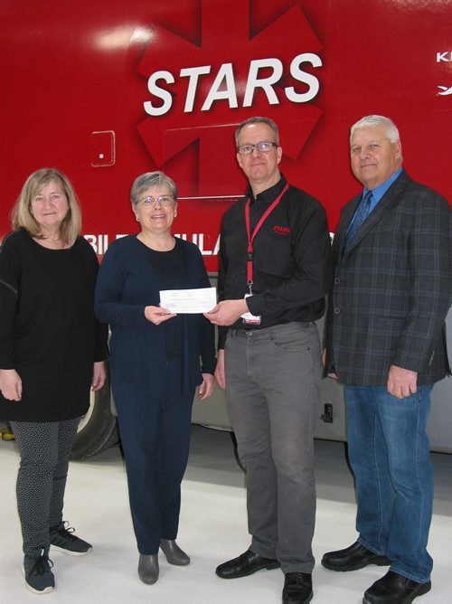 Canstar Community News March 5, 2019 - The RM of Rosser council agreed to donate $2, 744, which is $1 per capita for 2018 and 2019, to STARS Air Ambulance. The cheque presentation was made on March 5 with (from left) councillor Lee Garfinkel, reeve Frances Smee and (at right) councillor Ken Mulligan giving the donation to Troy Pauls, community education lead with STARS. (ANDREA GEARY/CANSTAR COMMUNITY NEWS)