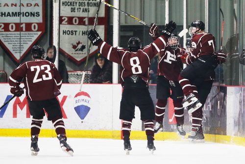 JOHN WOODS / WINNIPEG FREE PRESS
St Paul's High School  Jack Kaiser (21), right, and teammates celebrate Kaiser's goal against the Sturgeon Heights Huskies in the AAAA Provincial High School Championships Monday, March 11, 2019.