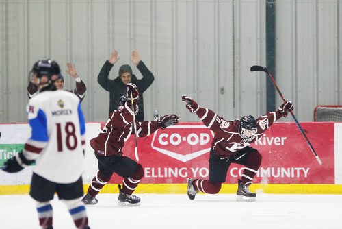 JOHN WOODS / WINNIPEG FREE PRESS
St Paul's High School  Jack Kaiser (21), right, celebrates his goal against the Sturgeon Heights Huskies in the AAAA Provincial High School Championships Monday, March 11, 2019.