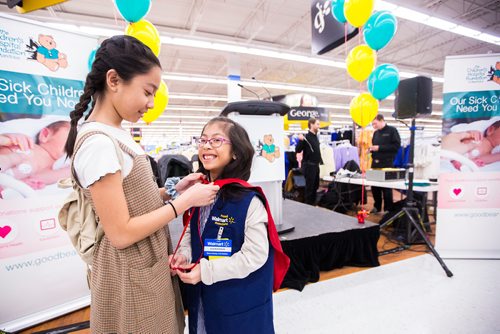 MIKAELA MACKENZIE / WINNIPEG FREE PRESS
Gianna Eusebio's sister, Milan (left), helps fix her cape after Gianna was crowned 2019 Champion Child for the Children's Hospital Foundation of Manitoba at the Walmart Winnipeg South Super Centre in Winnipeg on Tuesday, March 12, 2019. 
Winnipeg Free Press 2019.