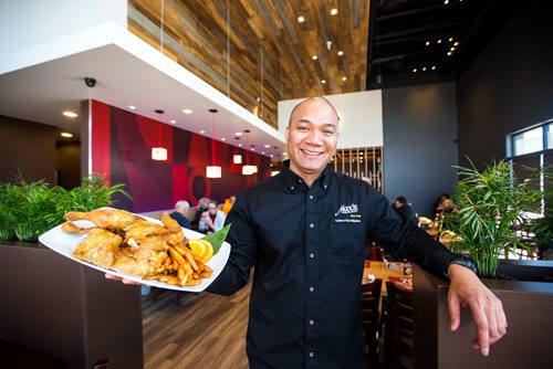 MIKAELA MACKENZIE / WINNIPEG FREE PRESS
Arnel Alibin, co-owner, holds up Max's signature fried chicken in Winnipeg on Tuesday, March 12, 2019. 
Winnipeg Free Press 2019.