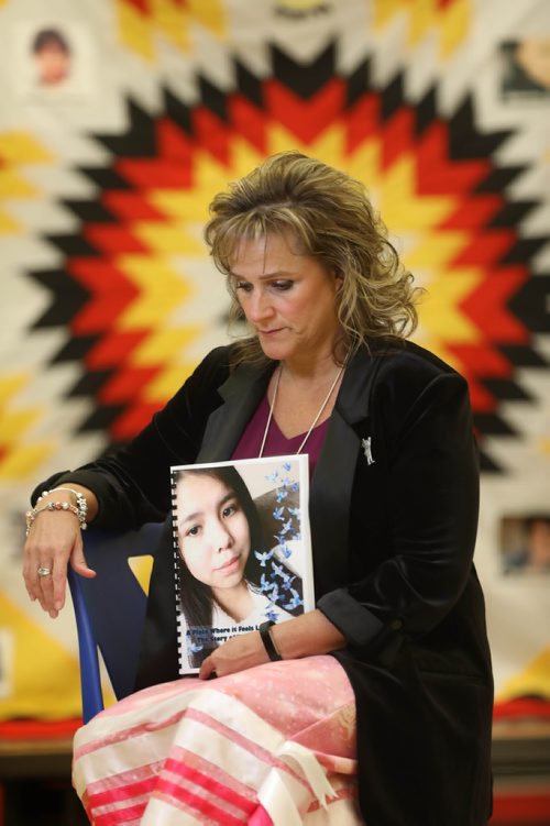 
RUTH BONNEVILLE / WINNIPEG FREE PRESS

Daphne Penrose with the Manitoba Advocate for Children and Youth who put together the report for the investigation into the death of Tina Fontaine,holds the  report in her hand after it was released to the press at Sagkeeng Mino Pimatiziwin Family Treatment Centre in Sagkeeng First Nation Tuesday. 

The quilt in the background was made by a member of the community and has Tina Fontaine's photo on it (top right) as well as other members of Sagkeeng First Nation who were murdered or are missing.  


March 12,, 2019
