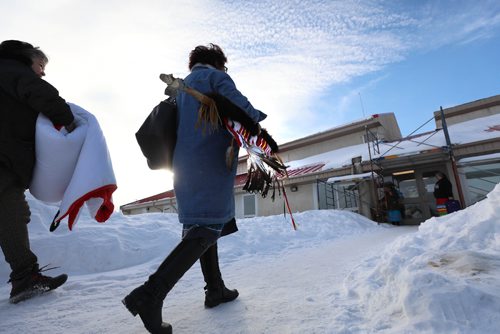 
RUTH BONNEVILLE / WINNIPEG FREE PRESS

Members of  Sagkeeng community bring a ceremonial staff into Sagkeeng Mino Pimatiziwin Family Treatment Centre just prior to a special report that was released by Manitoba Advocate for Children and Youth, regarding their investigation into the death of Tina Fontaine, in Sagkeeng First Nation Tuesday. 


March 12,, 2019
