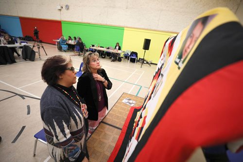 
RUTH BONNEVILLE / WINNIPEG FREE PRESS

Daphne Penrose with the Manitoba Advocate for Children and Youth who put together the report for the investigation into the death of Tina Fontaine, looks at a memorial quit with  Sagkeeng Councillor, Marilyn Courchene, after the report was released to the press at Sagkeeng Mino Pimatiziwin Family Treatment Centre in Sagkeeng First Nation Tuesday. 

The quilt  was made by a member of the community and has Tina Fontaine's photo on it (top right) as well as other members of Sagkeeng First Nation who were murdered or are missing.  


March 12,, 2019
