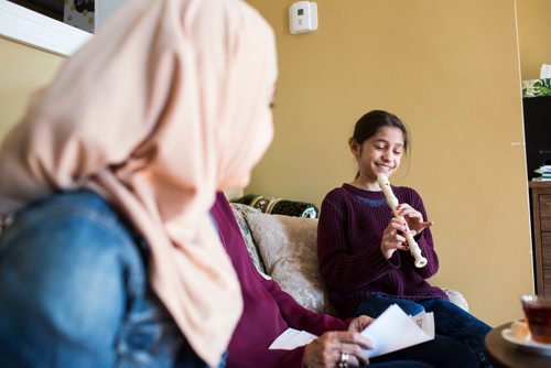 MIKAELA MACKENZIE / WINNIPEG FREE PRESS
Ghena Humsi, nine, plays her recorder for friends and family at the Humsi family home in Winnipeg on Tuesday, March 12, 2019. The two families met through a Volunteer Matching Program with the Manitoba Interfaith Immigration Council that pairs Canadians up with newcomers.
Winnipeg Free Press 2019.