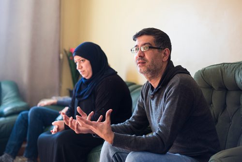 MIKAELA MACKENZIE / WINNIPEG FREE PRESS
Yasser Humsi talks with his Canadian friends at the Humsi family home in Winnipeg on Tuesday, March 12, 2019. The two families met through a Volunteer Matching Program with the Manitoba Interfaith Immigration Council that pairs Canadians up with newcomers.
Winnipeg Free Press 2019.