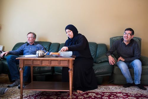 MIKAELA MACKENZIE / WINNIPEG FREE PRESS
Rolf Langelotz (left), Badyra Humsi, and Yasser Humsi visit at the Humsi family home in Winnipeg on Tuesday, March 12, 2019. The two families met through a Volunteer Matching Program with the Manitoba Interfaith Immigration Council that pairs Canadians up with newcomers.
Winnipeg Free Press 2019.