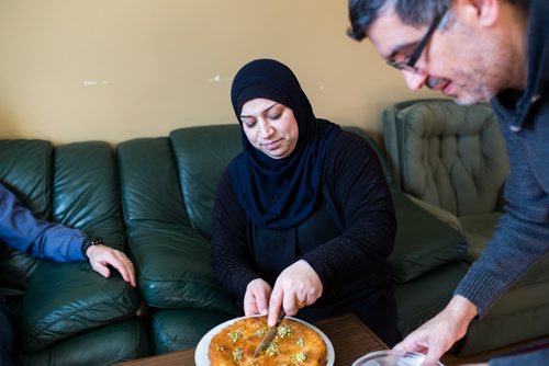 MIKAELA MACKENZIE / WINNIPEG FREE PRESS
Badyra Humsi serves her friends and family tea and baking at the Humsi family home in Winnipeg on Tuesday, March 12, 2019. The two families met through a Volunteer Matching Program with the Manitoba Interfaith Immigration Council that pairs Canadians up with newcomers.
Winnipeg Free Press 2019.