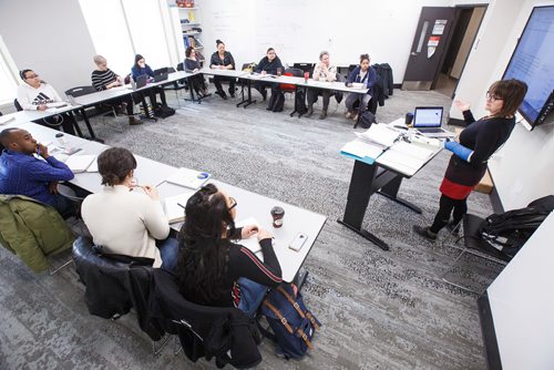 MIKE DEAL / WINNIPEG FREE PRESS
University of Winnipeg Urban and Inner-City Studies professor Shauna MacKinnon discusses the recently released 2019 provincial budget with her class Wednesday morning.
190313 - Wednesday, March 13, 2019.