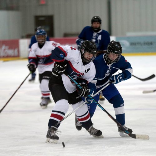 PHIL HOSSACK / WINNIPEG FREE PRESS -   St Mary Academy #2 Clare Hibbert and Selkirk Royal #16 Anna Sternat battle for the puckWednesday evening at the IcePlex in WWHSHL playoff action.  See Taylor Allen story.- March13, 2019.