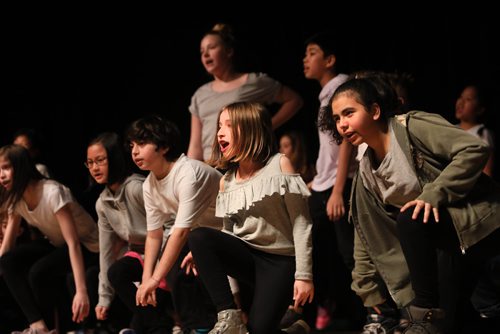 RUTH BONNEVILLE / WINNIPEG FREE PRESS

Standup - Winnipeg School Division Quantum Arts Program

Grade 5 & 6 students in the Prairie Theatre Exchange Quantum Arts musical theatre program perform on stage  at the Winnipeg Art Gallery, Muriel Richardson Auditorium Thursday.

More info:
Through the Quantum Arts Program, Grade 5 to 8 students from across WSD spent eight weeks receiving specialized arts training. The students spend two hours, twice a week working with professionals at Prairie Theatre Exchange, Royal Winnipeg Ballet and Winnipeg Art Gallery. 

Standup photo 

March 14,, 2019
