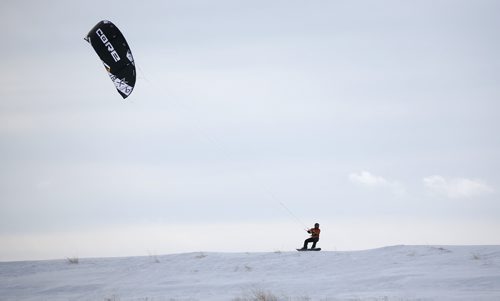 TREVOR HAGAN / WINNIPEG FREE PRESS
Chris Mason kite boarding and Daniel Koenig kite skiing along highway 59, north of Winnipeg, Thursday, March 14, 2019.