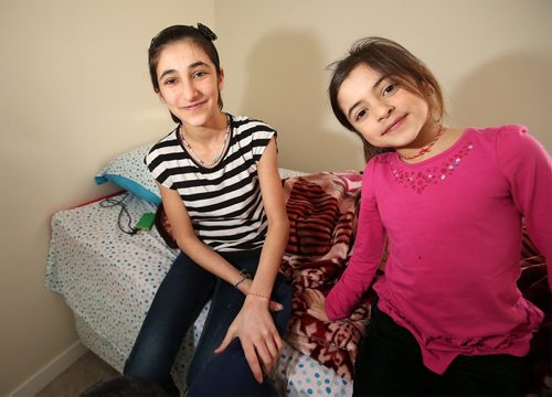 Sisters Elham and Shewaz in their family's Winnipeg Apartment. Feb.13, 2019. Shannon VanRaes/Winnipeg Free Press