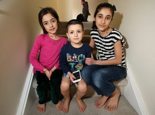 Siblings Shewaz, 6, Bewar, 5, and Elham, 11, in their family's Winnipeg Apartment. Feb.13, 2019. Shannon VanRaes/Winnipeg Free Press