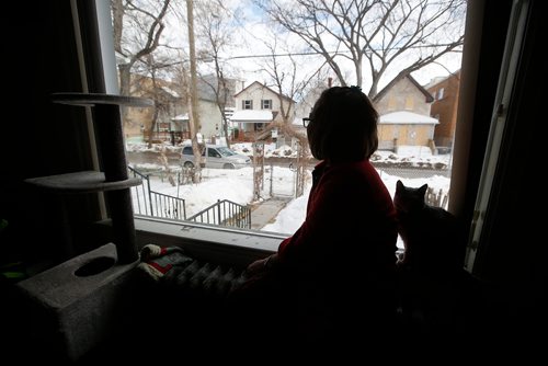 JOHN WOODS / WINNIPEG FREE PRESS
On Sunday, March 17, 2019 Rowena Catacudan, a neighbour of Jaime Adao, looks over at 745 McGee where Adao was killed during a random home invasion May 3 in Winnipeg . Charges have been laid against Ronald Bruce Chubb.