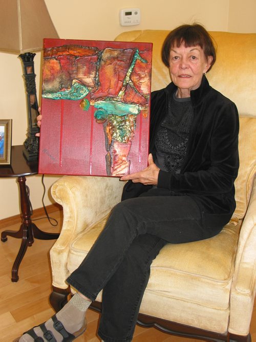 Canstar Community News March 12, 2019 - La Salle artist Marie Sumner shows one of her mixed media pieces that will be displayed at the upcoming Artarama Art Exhibition and Sale from March 29 to 31. (ANDREA GEARY/CANSTAR COMMUNITY NEWS)