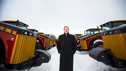 MIKAELA MACKENZIE / WINNIPEG FREE PRESS
Adam Reid, sales and marketing vice president for Buhler/Versatile, poses for a portrait with Versatile tractors in Winnipeg on Monday, March 18, 2019. Buhler recently partnered with Japanese tractor company Kubota, and will make larger horsepower tractors for Kubota.
Winnipeg Free Press 2019.