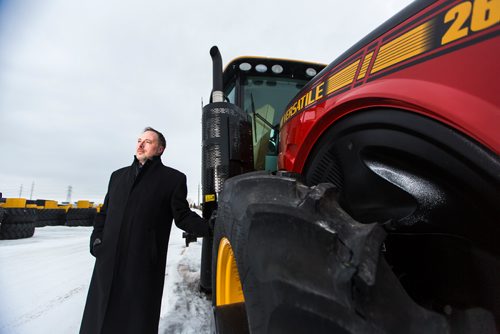 MIKAELA MACKENZIE / WINNIPEG FREE PRESS
Adam Reid, sales and marketing vice president for Buhler/Versatile, poses for a portrait with Versatile tractors in Winnipeg on Monday, March 18, 2019. Buhler recently partnered with Japanese tractor company Kubota, and will make larger horsepower tractors for Kubota.
Winnipeg Free Press 2019.
