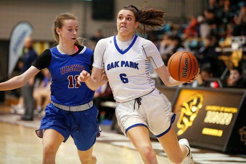 JOHN WOODS / WINNIPEG FREE PRESS
Oak Park Raiders' Claire Signatovich (6) makes gets around Sturgeon Heights Huskies' Ella Russell (11) in the Manitoba High SchooI 2019 AAAA Provincial Basketball Championship at the University of Manitoba Monday, March 18, 2019.