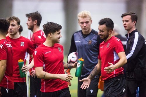 MIKAELA MACKENZIE / WINNIPEG FREE PRESS
Newly signed Michael Petrasso, midfielder (left), gets welcomed to practice at the Subway South Soccer Complex in Winnipeg on Monday, March 18, 2019. 
Winnipeg Free Press 2019.