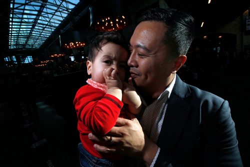 PHIL HOSSACK / WINNIPEG FREE PRESS - Paul Lacap and his son Nate pose at the Forks Market Tuesday. See Jen Zoratti's story re Paternal Leave. - March19, 2019.