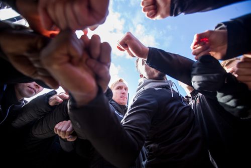 MIKAELA MACKENZIE / WINNIPEG FREE PRESS
Valour FC players and coaches huddle while visiting the Valour Road Commemorative Plaza to learn about the inspiration and naming of Valour FC in Winnipeg on Wednesday, March 20, 2019. 
Winnipeg Free Press 2019.