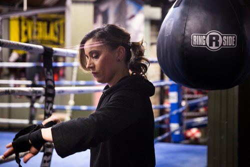 MIKAELA MACKENZIE / WINNIPEG FREE PRESS
Sabrina Carnevale, new health columnist, gets ready at the at Pan Am Boxing Club for a noon class in Winnipeg on Thursday, March 21, 2019. 
Winnipeg Free Press 2019.