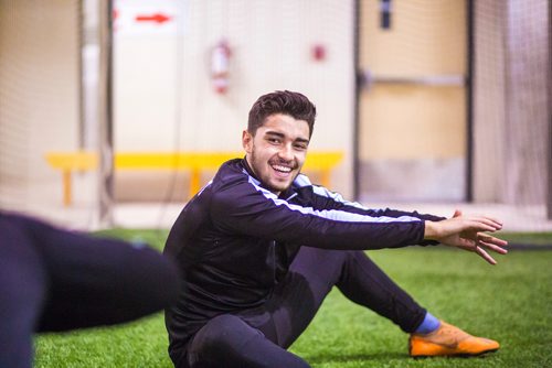 MIKAELA MACKENZIE / WINNIPEG FREE PRESS
Dylan Sacramento stretches at Valour FC practice at the Subway South Soccer Complex in Winnipeg on Friday, March 22, 2019. 
Winnipeg Free Press 2019.