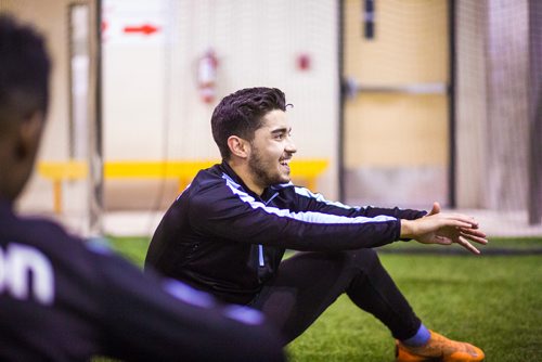 MIKAELA MACKENZIE / WINNIPEG FREE PRESS
Dylan Sacramento stretches at Valour FC practice at the Subway South Soccer Complex in Winnipeg on Friday, March 22, 2019. 
Winnipeg Free Press 2019.