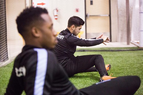 MIKAELA MACKENZIE / WINNIPEG FREE PRESS
Dylan Sacramento stretches at Valour FC practice at the Subway South Soccer Complex in Winnipeg on Friday, March 22, 2019. 
Winnipeg Free Press 2019.