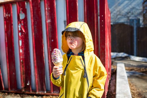 MIKAELA MACKENZIE / WINNIPEG FREE PRESS
Bennet Komarnicki, four, takes a lick of the first cone of the season (before the official opening time) at Bridge Drive In on opening day in Winnipeg on Friday, March 22, 2019. He lives nearby and has been waiting all winter for ice cream.
Winnipeg Free Press 2019.