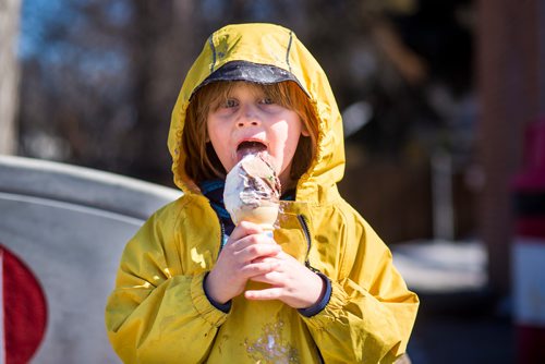 MIKAELA MACKENZIE / WINNIPEG FREE PRESS
Bennet Komarnicki, four, takes a lick of the first cone of the season (before the official opening time) at Bridge Drive In on opening day in Winnipeg on Friday, March 22, 2019. He lives nearby and has been waiting all winter for ice cream.
Winnipeg Free Press 2019.