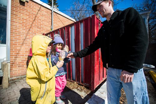 MIKAELA MACKENZIE / WINNIPEG FREE PRESS
Riley Gibbons, BDI employee, gives Bennet Komarnicki, four (left), and Sheridan Hoeksema, five, the very first cones (before the official opening time) at Bridge Drive In on opening day in Winnipeg on Friday, March 22, 2019. They live nearby and have been waiting all winter for ice cream.
Winnipeg Free Press 2019.