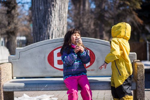 MIKAELA MACKENZIE / WINNIPEG FREE PRESS
Sheridan Hoeksema, five (left), and Bennet Komarnicki, four, are the very first to get a cone (before the official opening time) at Bridge Drive In on opening day in Winnipeg on Friday, March 22, 2019. They live nearby and have been waiting all winter for ice cream.
Winnipeg Free Press 2019.