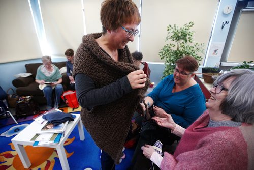 JOHN WOODS / WINNIPEG FREE PRESS
Pamela Sersun tries on her Outlander inspired sweater vest for Frankie O'Brien and Mary-Anne Derrick during a Norwood Naughty Knitters meeting at Norwood Community Centre in Winnipeg Sunday, March 24, 2019.