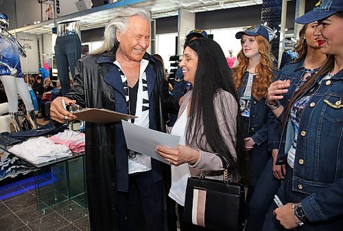 JASON HALSTEAD / WINNIPEG FREE PRESS

Customer Pinky Sirha (right) with Peter Nygard, founder and chairman of Nygard International, on March 15, 2019, at the Nygard fashion show in support of breast cancer research and to preview the companys new spring/summer fashions at the Nygard Fashion Park store on Kenaston Boulevard. (See Social Page)
