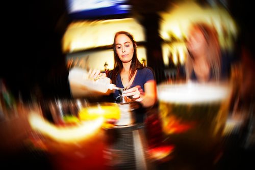 JOHN WOODS / WINNIPEG FREE PRESS
Tori Jones and Tessa Grant, lounge servers, serve up drinks during happy hour at Earl's on Main in Winnipeg Monday, March 25, 2019.