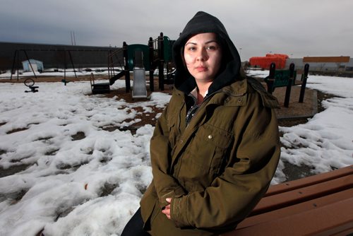 PHIL HOSSACK / WINNIPEG FREE PRESS - Hailee Martin poses on a children's play structure near where trash associated with the making of meth litters Farlinger Park on Garden Park Drive north of Leila.  (NOTE: park is known as Farlinger on Google Maps but a sign in the park id's it as Chochinov Park). See Alex Paul's story. - March 26, 2019.